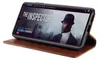 A smartphone in a brown leather flip case is shown, displaying a movie poster on its screen. Produktbild-Vorschau