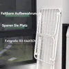 A white folding drying rack is shown leaning against a wall next to a window. Produktbild-Vorschau