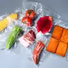 A collection of vacuum-sealed food items arranged on a light gray surface. Produktbild-Vorschau