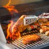 Meat and sausages being grilled over open flames. Podgląd zdjęcia produktu