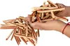 Hands holding a pile of dog treats. Produktbild-Vorschau
