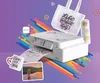 A Brother sublimation printer is shown printing designs onto various items like a mug, tote bag, and a cylindrical object, surrounded by colorful abstract shapes and dog-themed graphics. Náhled obrázku produktu