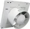 A white wall-mounted ventilation fan is shown from a diagonal angle, with the fan blades visible inside the housing. A label with text and symbols is attached to the fan's duct. Anteprima dell’immagine prodotto