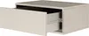 A single, light gray, wall-mounted nightstand with one open drawer is shown against a white background. Anteprima dell’immagine prodotto