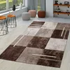 A modern living room scene with a rug, side tables, and poufs. Produktbild-Vorschau