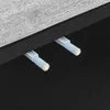A close-up view of two magnetic catches attached to the underside of a piece of furniture, likely a cabinet or bed frame. Podgląd zdjęcia produktu