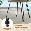 Close-up of the legs of a patio furniture set, showing adjustable feet and the metal frame, with a blurred background of water and sky. Podgląd zdjęcia produktu
