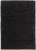 A close-up, top-down view of a black shaggy rug. Produktbild-Vorschau