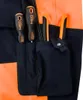 Close-up of work pants with tools in pockets. Produktbild-Vorschau