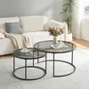 A living room scene with a couch, coffee tables, and a plant. Produktbild-Vorschau