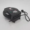A black waffle maker with its cord and plug is shown on a white background. Náhled obrázku produktu