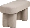A studio shot of a beige upholstered bench with unique, curved legs. Podgląd zdjęcia produktu