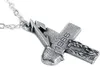 A close-up shot of a silver-colored cross pendant with the year "1986" engraved on it, attached to a chain. Produktbild-Vorschau