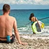 Two people on a beach with a paddleboard. Podgląd zdjęcia produktu