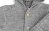 Close-up of a grey hooded baby overall with wooden buttons. Produktbild-Vorschau