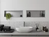 A modern bathroom vanity with a sink, towels, and shelves with toiletries. Náhled obrázku produktu
