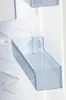 A close-up view of a clear plastic shelf inside a refrigerator. Produktbild-Vorschau