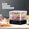 A food dehydrator with multiple trays filled with dried food, placed on a countertop with jars and some dried fruit in the foreground. Produktbild-Vorschau