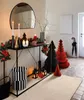 A hallway decorated for Christmas with a console table, mirror, and festive decor. Náhled obrázku produktu