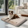 A dog is lying on a plush dog bed in a modern living room with large windows and a sofa. Anteprima dell’immagine prodotto