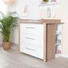 A baby changing station with drawers and shelves, next to a potted plant. Anteprima dell’immagine prodotto