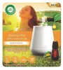 A woman enjoying the scent of an aroma mist diffuser in a sunny meadow. Podgląd zdjęcia produktu