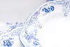 A close-up view of two white porcelain plates with blue floral patterns. Podgląd zdjęcia produktu