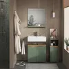 A modern bathroom with a green vanity, sink, mirror, and shower. Voir les images du produit