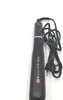 A black hair styling tool with gold accents and a black cord lies on a white background. Náhľad obrázku produktu