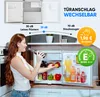 A woman is taking a bottle of drink from a small refrigerator, with marketing information displayed above the refrigerator. Produktbild-Vorschau