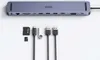 A docking station and its accessories are laid out on a white background. Produktbild-Vorschau