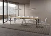 A modern dining room with a long wooden table and white chairs, set against a brick wall and large windows overlooking a mountain landscape. Podgląd zdjęcia produktu