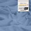 A crumpled light blue fabric with a label overlay. Produktbild-Vorschau