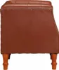 A side view of a brown leather armchair on a white background. Produktbild-Vorschau