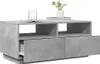A modern, concrete-effect coffee table with open shelving and drawers, presented against a white background. Náhled obrázku produktu