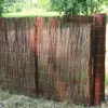 A close-up view of a woven reed fence, likely used for privacy screening in a garden setting. Produktbild-Vorschau