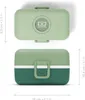 A top and side view of a green lunchbox with dimensions indicated. Produktbild-Vorschau