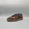 A single adidas Samba OG shoe with a leopard print pattern is shown against a plain gray background. Produktbild-Vorschau