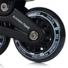 Close-up view of the wheels and frame of inline skates. Voir les images du produit