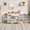 A white sideboard with drawers and shelves filled with kitchen items and decor, set against a light-colored wall. Voir les images du produit