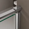 Close-up view of a shower door's corner fitting and glass edge, attached to a wall. Produktbild-Vorschau