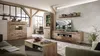 Vitrine BELLANO Viking Oak Nature mit LED in Gesamtansicht im hellen Wohnzimmer mit Holzrahmen-Elementen und weiteren Möbeln. Produktbild-Vorschau