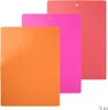 Three flexible cutting boards of different sizes and colors are stacked on a white background. Voir les images du produit