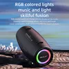 A black portable speaker with RGB lights is displayed on a rocky surface with a blurred background of water and crystals. Produktbild-Vorschau