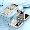 Three phone cases with intricate metallic designs are displayed on a light blue and white layered surface. Produktbild-Vorschau