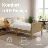 A bedroom scene featuring a wooden bed with white bedding, bedside tables, and lamps. Produktbild-Vorschau