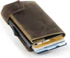 A close-up shot of a brown leather wallet with cards sticking out. Produktbild-Vorschau