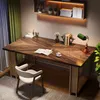 A home office setup with a desk, chair, lamp, and books. Anteprima dell’immagine prodotto