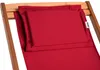 A close-up view of a red cushion on a wooden chair. Náhľad obrázku produktu