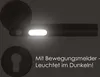 A close-up of a black door handle with a glowing light strip and a keyhole escutcheon below it, with German text overlay. Produktbild-Vorschau